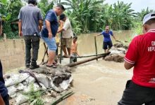 Photo of Tanggul Sungai Jebol di Kota Rantang, Dinas SDABMBK Deli Serdang Turun Tangan